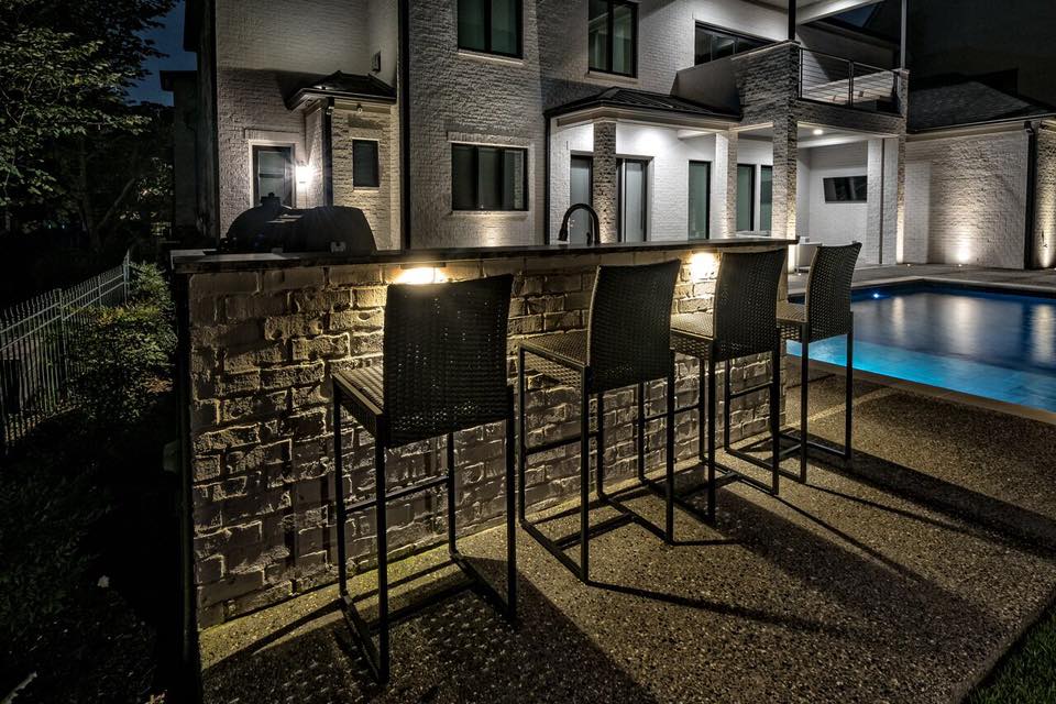 small outdoor kitchen lighting feature under countertops