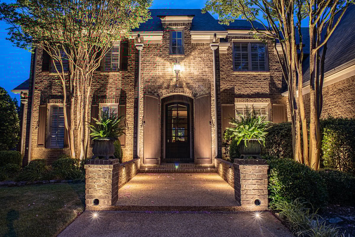House walkway and entrance with outdoor lighting