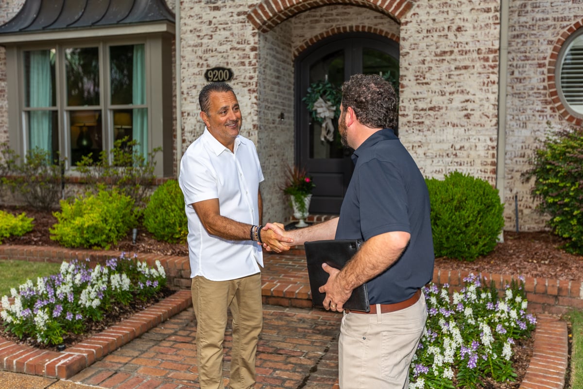 customer and technician meeting for landscape lighting consultation