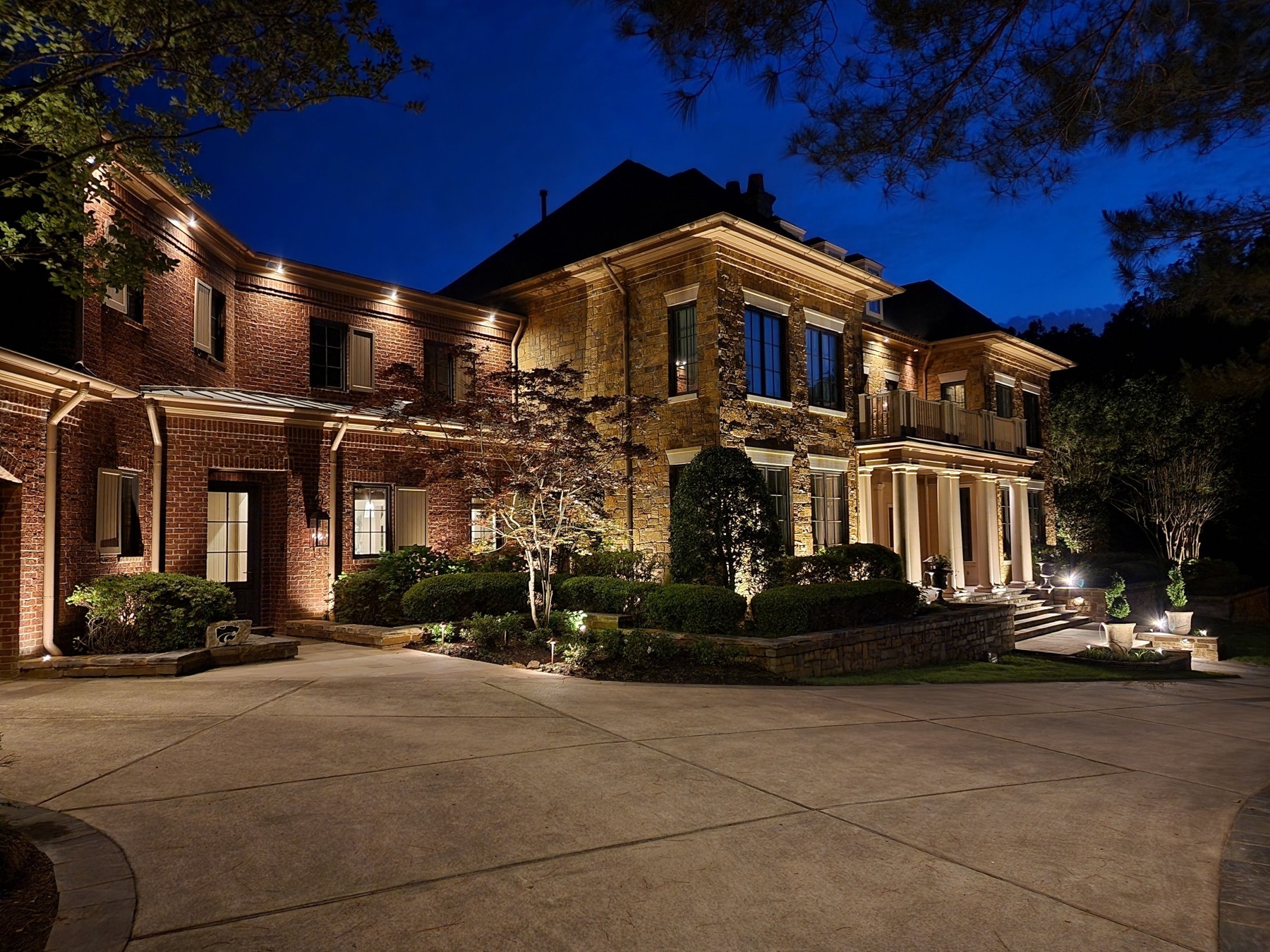 House with landscape lighting and architectural lighting